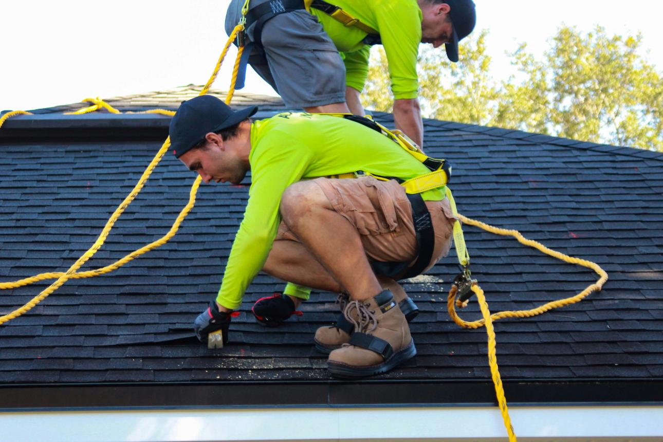 Roofers working on a house